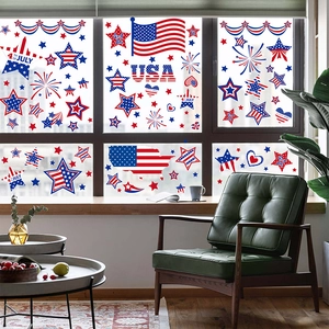 Independence Day window clings with USA flags and stars on a bright glass window