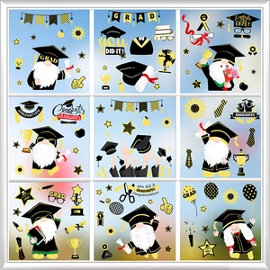 Close-up of graduation window clings with cartoon gnomes, diplomas and golden trophy decals