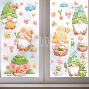 Close-up of gnome and spring flower decals on a glass window with soft lighting