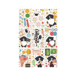Nine colorful graduation gnome window stickers with owls and trophies for 2026 party decor
