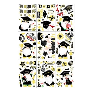 Set of 9 graduation gnome window clings with black and gold stars and congrats text
