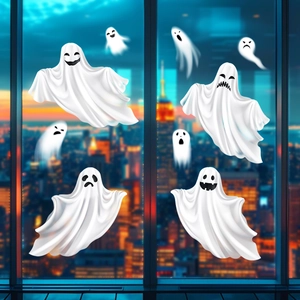 Detailed view of eight unique white ghost window stickers on glass for Halloween decor