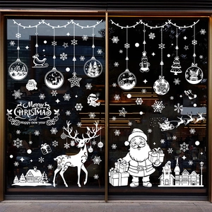 White Christmas window decals featuring Santa, reindeer, and snowflakes for glass decor