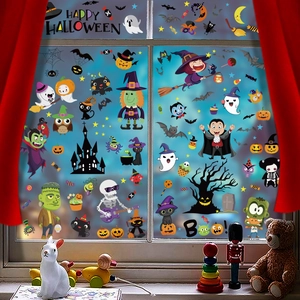 Detailed view of Halloween window clings featuring pumpkins, ghosts and witches on glass