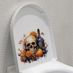 Close-up of Halloween toilet sticker with skull, orange roses, and pumpkin detail