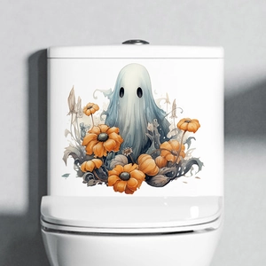 Close-up of Halloween toilet sticker featuring a cute blue ghost and orange pumpkins