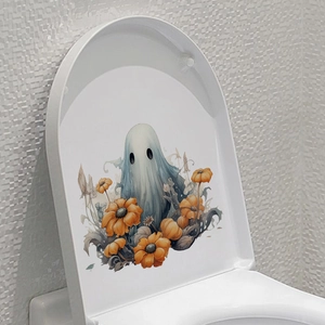 Ghost and pumpkin decal applied to toilet lid for Halloween bathroom decoration