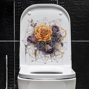 Detail of Halloween toilet lid sticker with orange roses and vintage spider web pattern