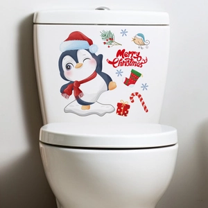 Christmas snowman and penguin decals applied on a white bathroom toilet water tank