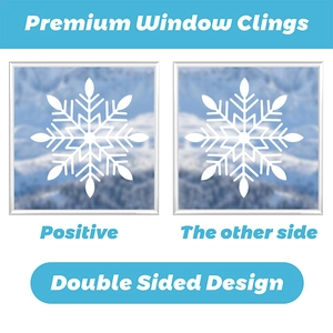 Detailed view of double-sided white snowflake window clings with a winter background scene