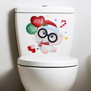 Detailed view of a cute elephant toilet sticker with festive Christmas hat and balloons