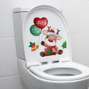 Close-up of a Christmas reindeer sticker with red heart balloon on white toilet tank