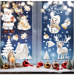 Detail of Christmas static window clings featuring Santa, reindeer, and snowy cabin designs