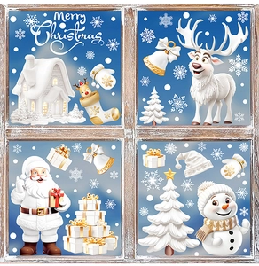 Close-up of white and gold Christmas window stickers with Santa, reindeer and snowflakes