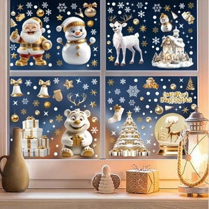 Detailed view of white and gold Christmas window decals with Santa, snowman and reindeer