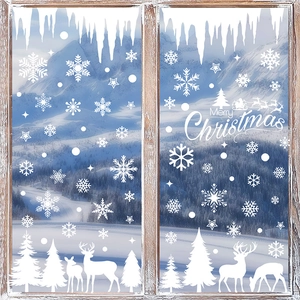 White Christmas window decals featuring snowflakes, reindeer, and forest on a glass pane