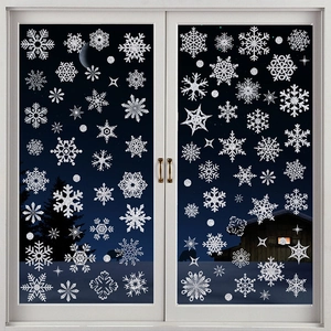 Glitter snowflake window decals with white stars on glass door for Christmas decor