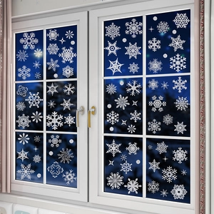 Glittery white snowflake window stickers for Christmas and winter holiday home decor