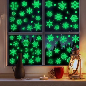 Glow in the dark snowflake window stickers with fluorescent green patterns for Christmas decor