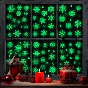 Glow-in-the-dark snowflake window stickers in bright neon green for Christmas party decor