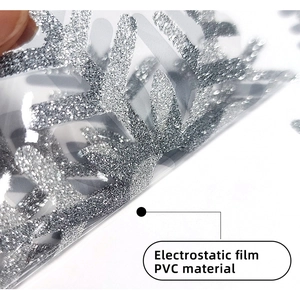 Macro shot of silver glitter snowflake window sticker with electrostatic PVC film