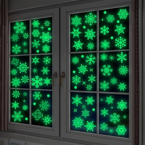 Luminous snowflake window stickers with glowing green patterns for Christmas party decor
