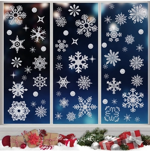 Close-up of glittery silver snowflake window stickers with festive Christmas decorations