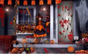 Detailed view of Halloween blood splatter stickers and skull window clings on a door
