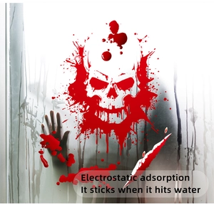 Close-up of Halloween bloody skull and handprint window stickers with electrostatic cling