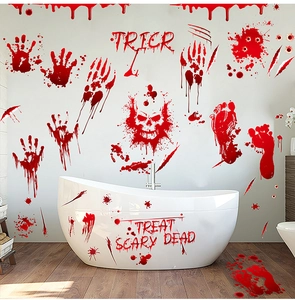 Detail of bloody handprints and skull decals on a white bathtub for Halloween decor