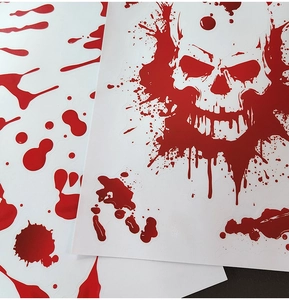 Detail shot of Halloween bloody footprint wall stickers and red skull window clings