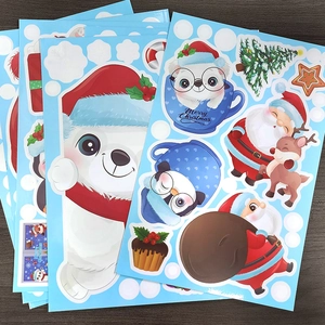 Christmas window stickers featuring cute polar bears and Santa on a dark wooden background