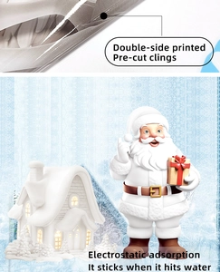 Detailed view of double-sided printed Christmas static stickers with Santa and snow scene