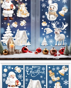 Detail of Christmas window stickers showing snowflakes, reindeer, and Santa Claus motifs