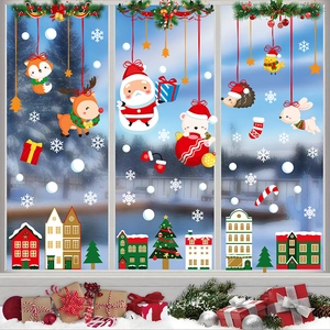 Christmas window stickers featuring Santa, reindeer, and snowflakes on a glass pane