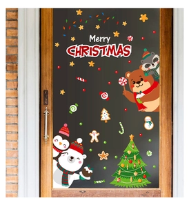 Detailierte Weihnachts-Fensterbilder mit Bären und Pinguinen auf einer Glastür