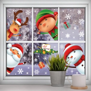 Christmas window decals with Santa, reindeer and snowman on a white window frame