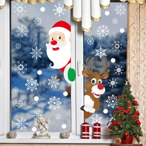Christmas window stickers set with Santa, reindeer and white snowflakes on glass pane