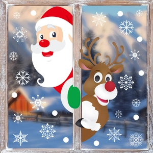 Detail of Christmas window clings featuring Santa Claus, reindeer and white snowflakes