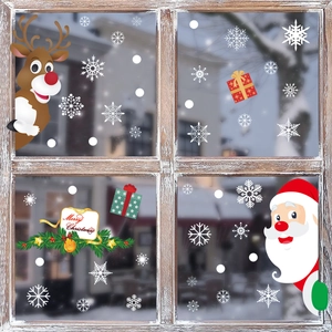 Detailed Christmas window stickers featuring Santa Claus, reindeer, and snowflakes on glass