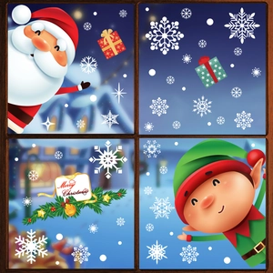 Christmas window stickers set featuring Santa, elves and snowflakes on a glass window pane