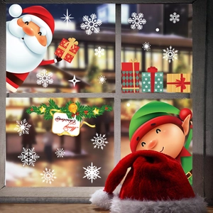Detail of Christmas window stickers with Santa, elves and snowflakes on glass