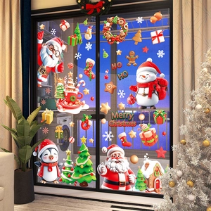 Festive Christmas window decals featuring Santa, snowman and reindeer on glass balcony doors
