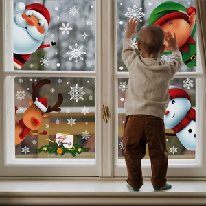 Christmas window stickers set featuring Santa, reindeer, and snowflakes in a cozy home setting