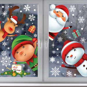 Detailed view of Christmas window clings with Santa, reindeer, and snowflakes on glass
