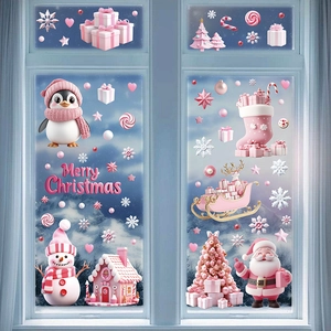 Pink Christmas window stickers with Santa, penguin, and candy house on glass pane