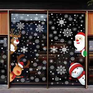 Detailed view of Santa, reindeer and snowman static decals on a glass window display