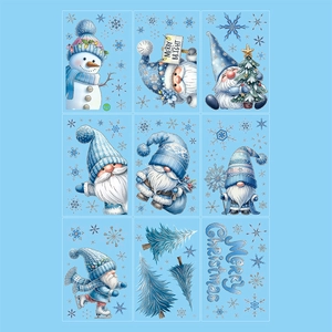 Blue glitter Christmas window stickers featuring snowman and gnome designs for holiday decor
