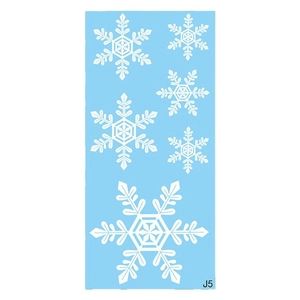 Detail view of 6 white snowflake window stickers in various sizes on light blue backing paper