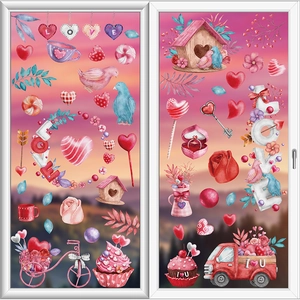 Close-up of Valentine window decals featuring pink birds, birdhouse, and romantic elements